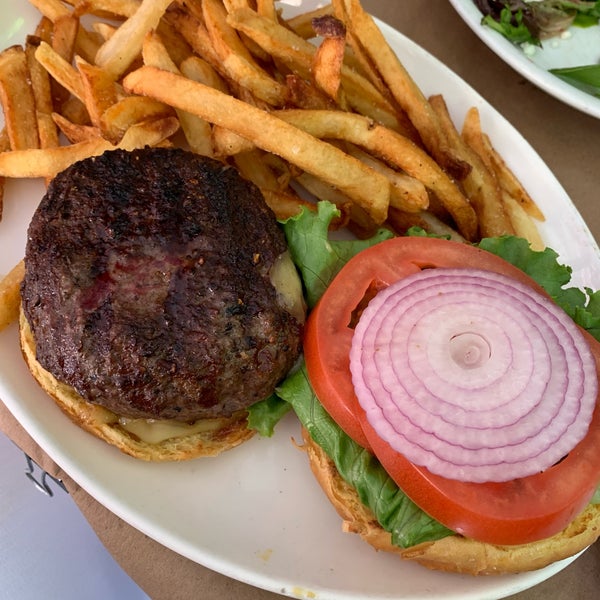 Good-sized burger and fries. Loved the terrace — very quiet on a Thursday at lunch.