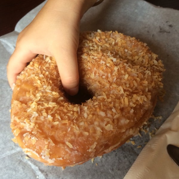 Attention! They sell fresh doughnuts from "Dough" in Bed-Stuy. This toasted coconut is unforgettable. Get there early cause they go fast.