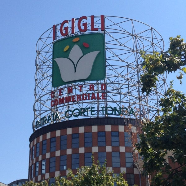 Photo taken at I Gigli Shopping Centre by Dario R. on 8/18/2013
