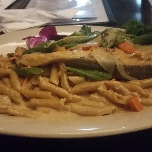 The kitchen is open late. Try the rasta pasta with steamed salmon. The rum punch is strong but good.