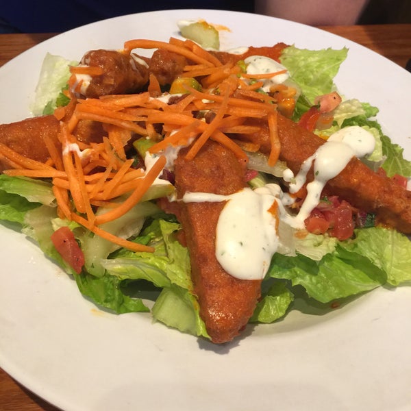 Photo taken at Veggie Grill by Laura L. on 2/14/2015