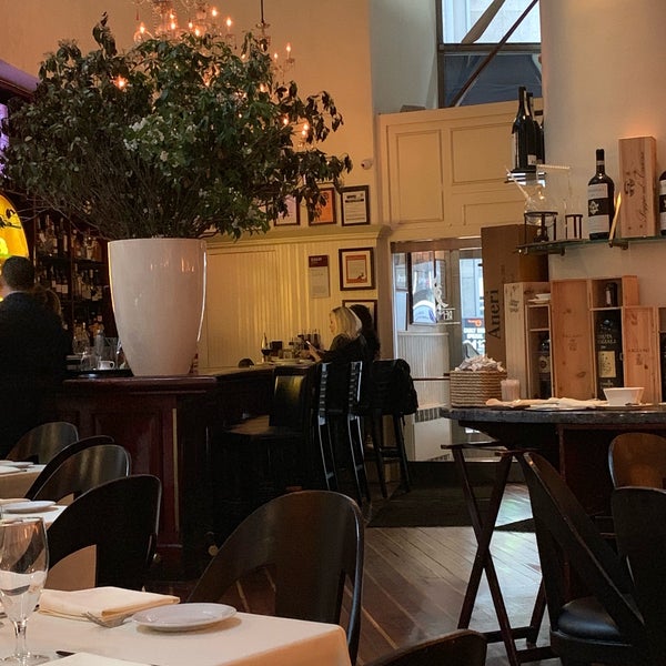 Photo taken at Remi Restaurant by Richard G. on 6/18/2019