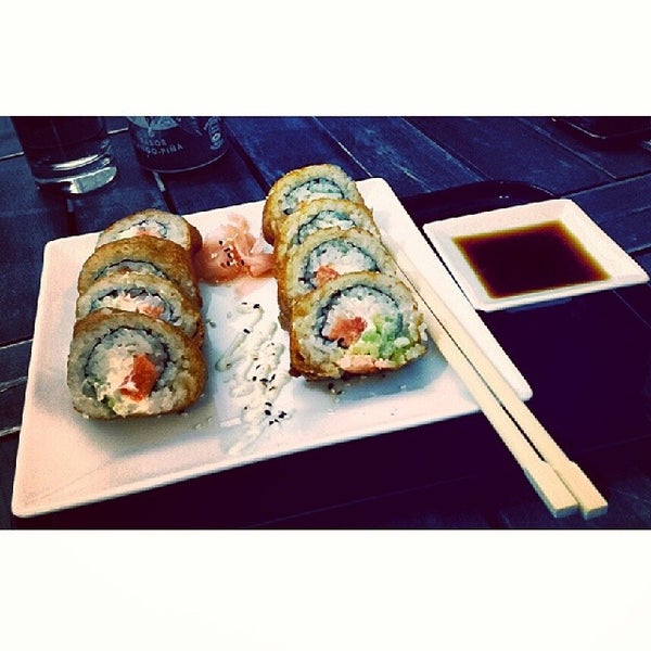 Photo taken at Natural Wok + Sushi Bar by Miguel P. on 2/19/2014