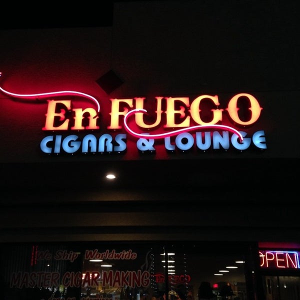 Photo taken at En Fuego Cigars &amp; Lounge by Dennis on 7/21/2014