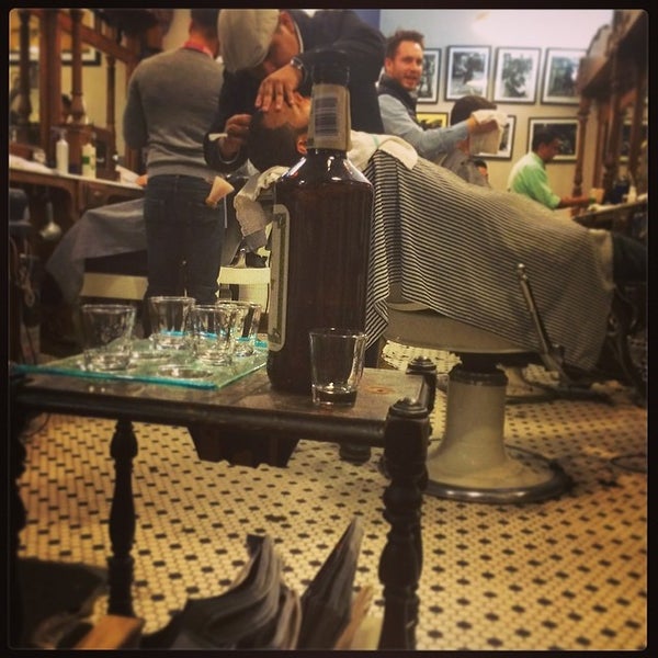 Photo taken at Neighborhood Cut and Shave Barber Shop by Omer N. on 2/7/2014