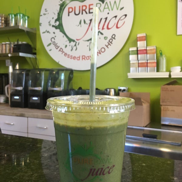 Photo taken at Pure Raw Juice Organic Juice Bar &amp; Cafe by Alma A. on 3/18/2016