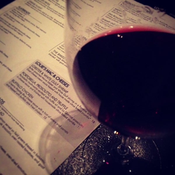Photo taken at Louie&#39;s Wine Dive by Chad C. on 12/15/2012