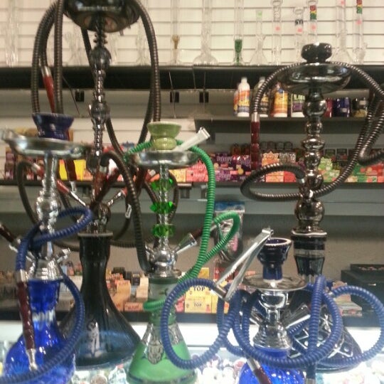 Photo taken at Dragon&#39;s Den Smoke Shop by Andres O. on 7/26/2012