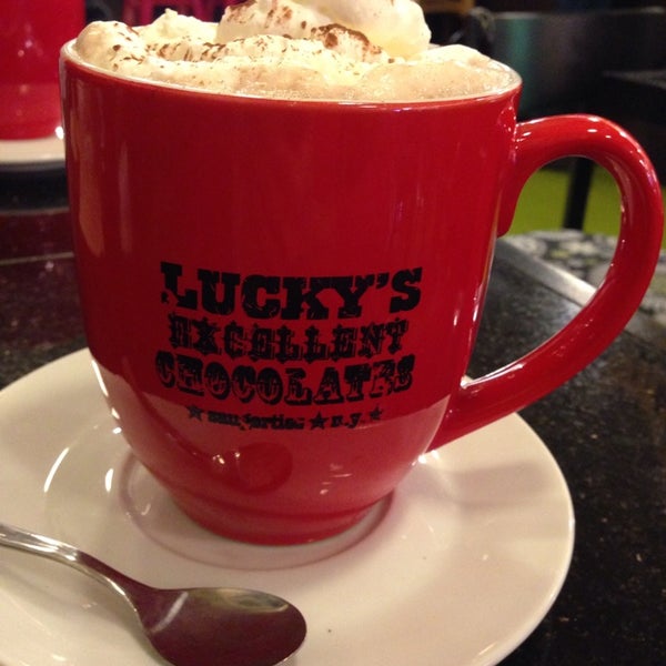 Photo taken at Lucky Chocolates, Artisan Sweets And Espresso by Morgan S. on 10/26/2014