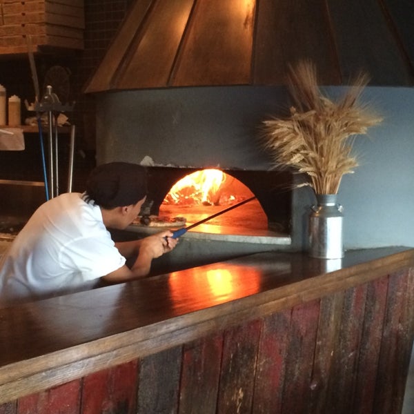 Photo taken at Dough Artisan Pizzeria by Craig B. on 8/7/2014