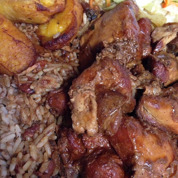 Photo taken at Golden Krust Caribbean Restaurant by Bina E. on 2/6/2014
