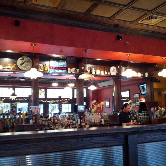 Photo taken at Siné Irish Pub &amp; Restaurant by Steven P. on 12/27/2012