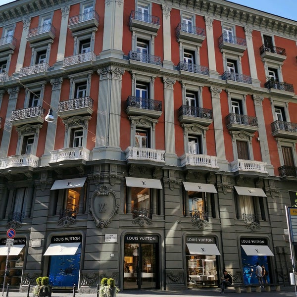 Louis Vuitton and the steps that lead up from the store in Via dei Mille in  Naples, Italy