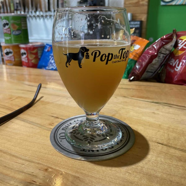 Photo taken at Pop the Top Craft Beer Shop by Joe E. on 3/18/2022