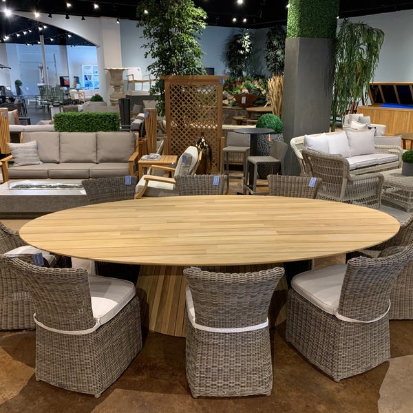 Gorgeous dining set with 124" oval teak dining table and all-weather wicker dining chairs