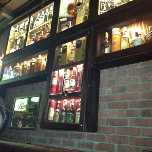 Photo taken at The BLACK STUFF Irish Pub &amp; Whisky Bar by Anastácia C. on 3/15/2013