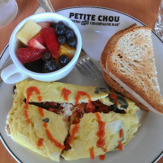 Photo taken at Petite Chou Bistro and Champagne Bar by Lynette V. on 6/24/2013