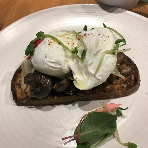 Mushroom tarting with poached eggs. Delicious breakfast choice.