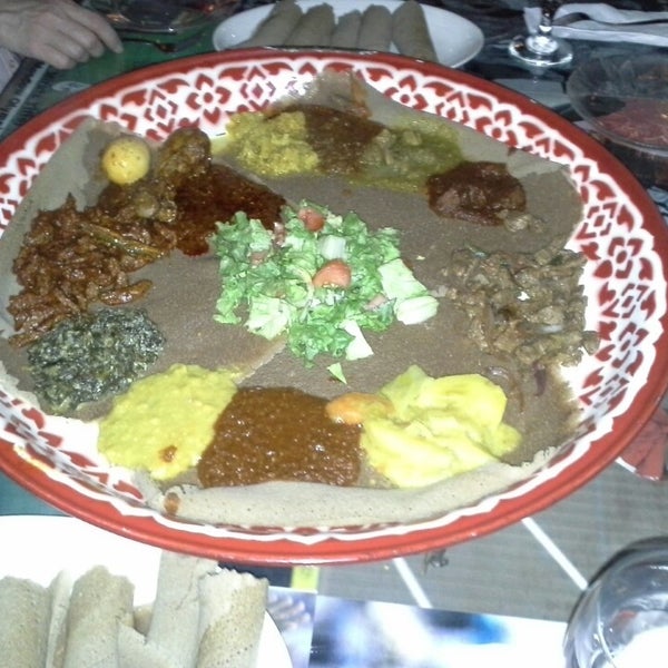 Photo taken at Queen of Sheba Ethiopian Restaurant by Maria M. on 2/15/2014