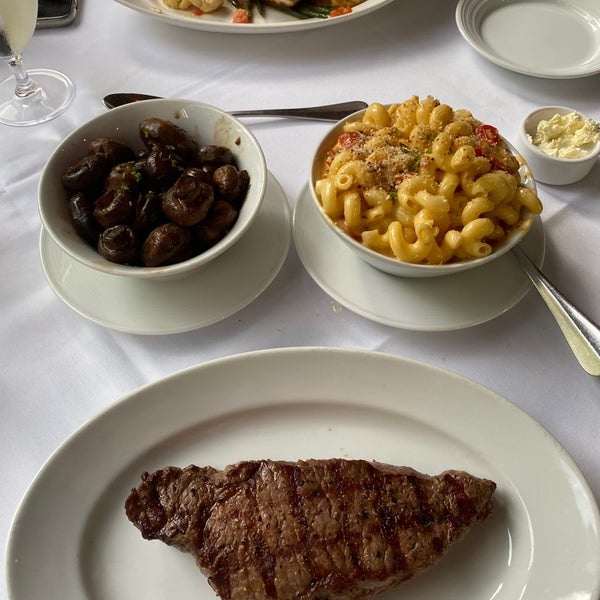 My wife ordered the Red Snapper and I went with the New York Strip (medium rare) accompanied with grilled mushrooms and smoke Mac n Cheese. Everything was amazing!  They know how to do steak.