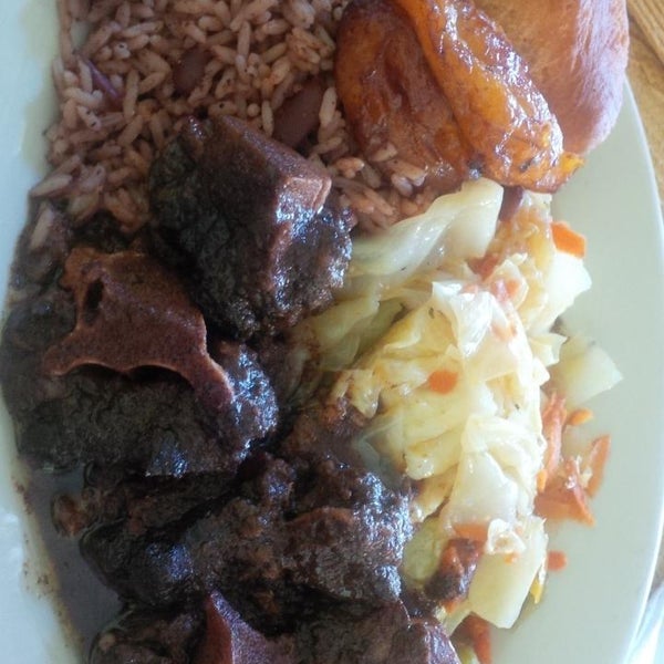 Photo taken at Ackee Bamboo Jamaican Cuisine by Michele C. on 7/11/2015