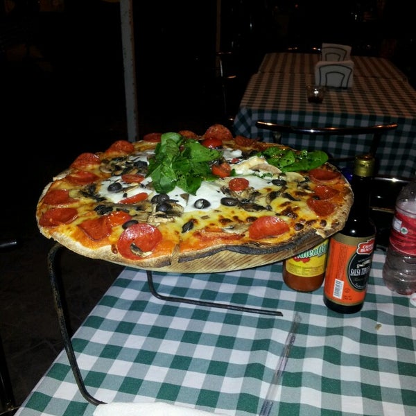 Photo taken at Osteria Marguerita. Pizza a La Leña by Cristina V. on 5/31/2014