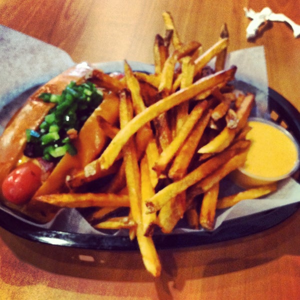 Foto diambil di Haute Dogs &amp; Fries Restaurant oleh Katie pada 4/12/2013