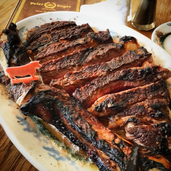 Photo taken at Peter Luger Steak House by Max B. on 7/25/2015
