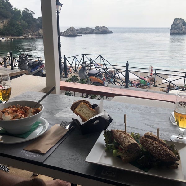 Two comfy beach beds for €10,- a day. Great lunch and beautiful view over the bay