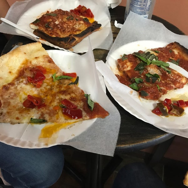 Seems to be a nyc institution. The square pizza has a thick and crispy crust and overall great flavor (not sweet compared to L&b's). The regular slice was  greasy & thin - throw in hot peppers there