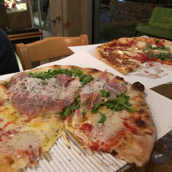 Photo taken at Howie&#39;s Artisan Pizza by Junko I. on 12/7/2019