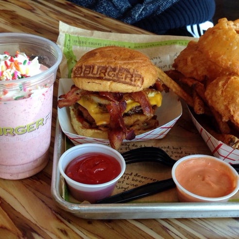 Photo taken at BurgerFi by Rainy Z. on 4/20/2014