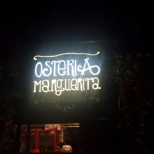 Photo taken at Osteria Marguerita. Pizza a La Leña by Melgem D. on 9/15/2013