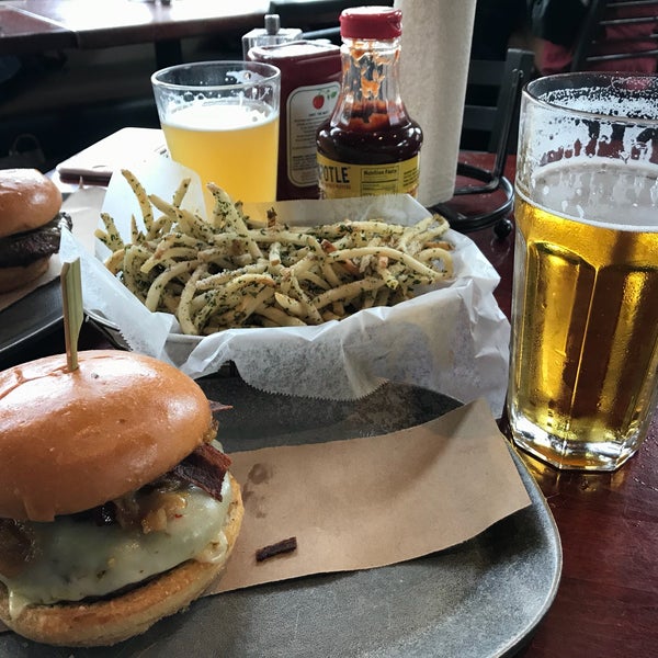 Photo taken at Village Burger Bar by Ray L. on 3/11/2018