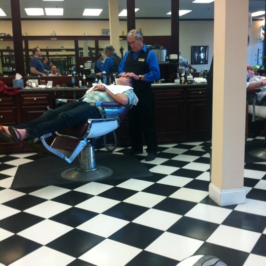 Photo taken at Gino&#39;s Classic Barber Shoppe by Cooper G. on 2/25/2012