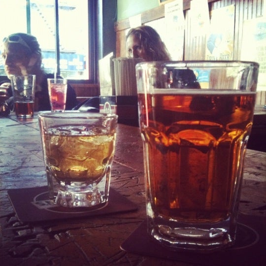 Photo taken at Mad Donkey Beer Bar &amp; Grill by Amy J. on 4/5/2012