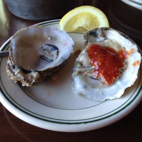 Photo taken at Molly Cool&#39;s Seafood Tavern by Katie S. on 5/18/2012