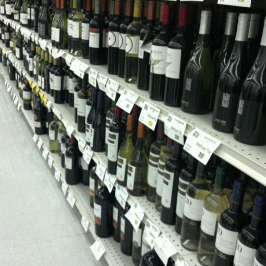 Photo taken at Exit 9 Wine &amp; Liquor Warehouse by Butterfly on 2/19/2012