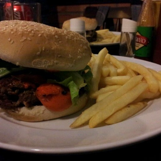 Photo taken at Rock&#39;a Burger by Murilo R. on 3/20/2012