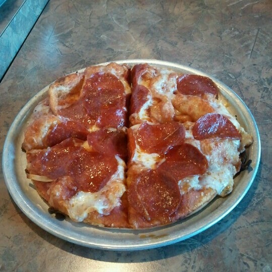 Photo taken at Roaring Rapids Pizza Co. by Dave C. on 1/4/2013