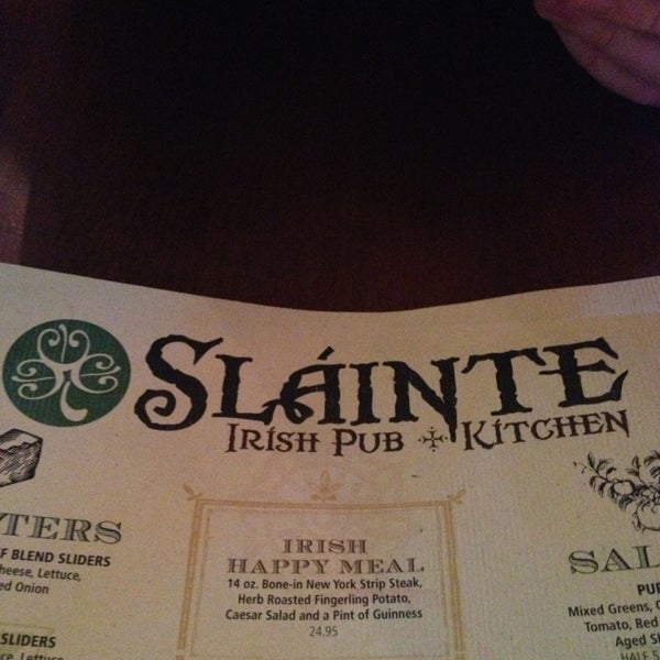 Photo taken at Slainte Irish Pub + Kitchen by Melissa L. on 2/23/2013