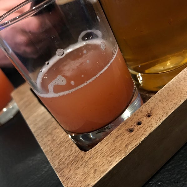 Photo taken at Upland Brewing Company Tasting Room by Ashley T. on 1/27/2019
