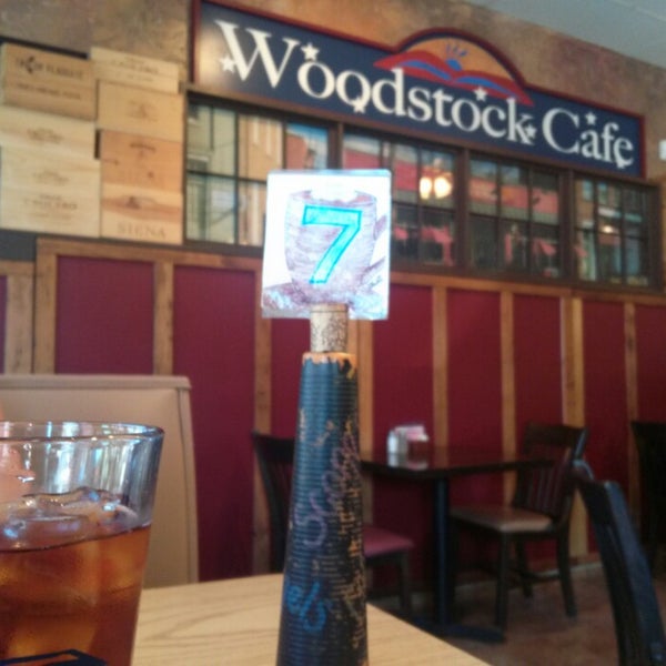 Photo taken at Woodstock Cafe &amp; Shoppes by Theresa L. on 8/29/2014