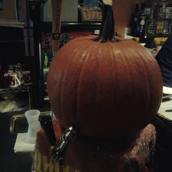 Pouring beer through a pumpkin