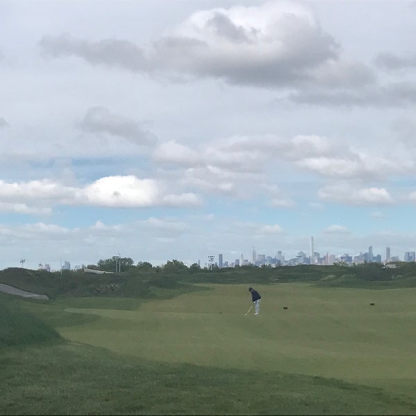 Photo taken at Trump Golf Links at Ferry Point by Sam Y. on 5/15/2017