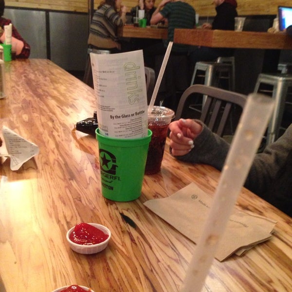 Photo taken at BurgerFi by Casey N. on 2/25/2014