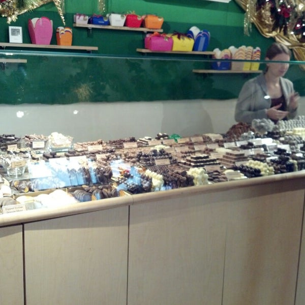 Photo taken at teuscher Chocolates - Rockefeller Center by Sarah on 11/21/2013