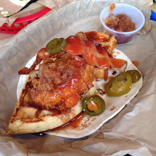 The Dogfather Taco might be one of the most unique, yet delicious tacos I've ever tasted! Yes - jalapeños, waffles, hot sauce, apple butter, bacon, syrup and chicken work together! Who knew!