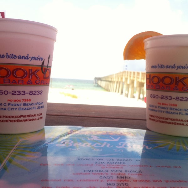 Photo taken at Hook&#39;d Pier Bar &amp; Grill by Lindsey D. on 7/24/2014