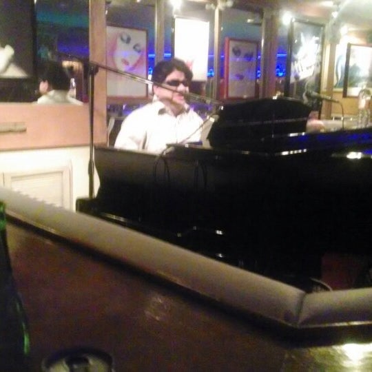 Photo taken at La Copa de Champagne Piano Bar by Erika F. on 2/4/2014